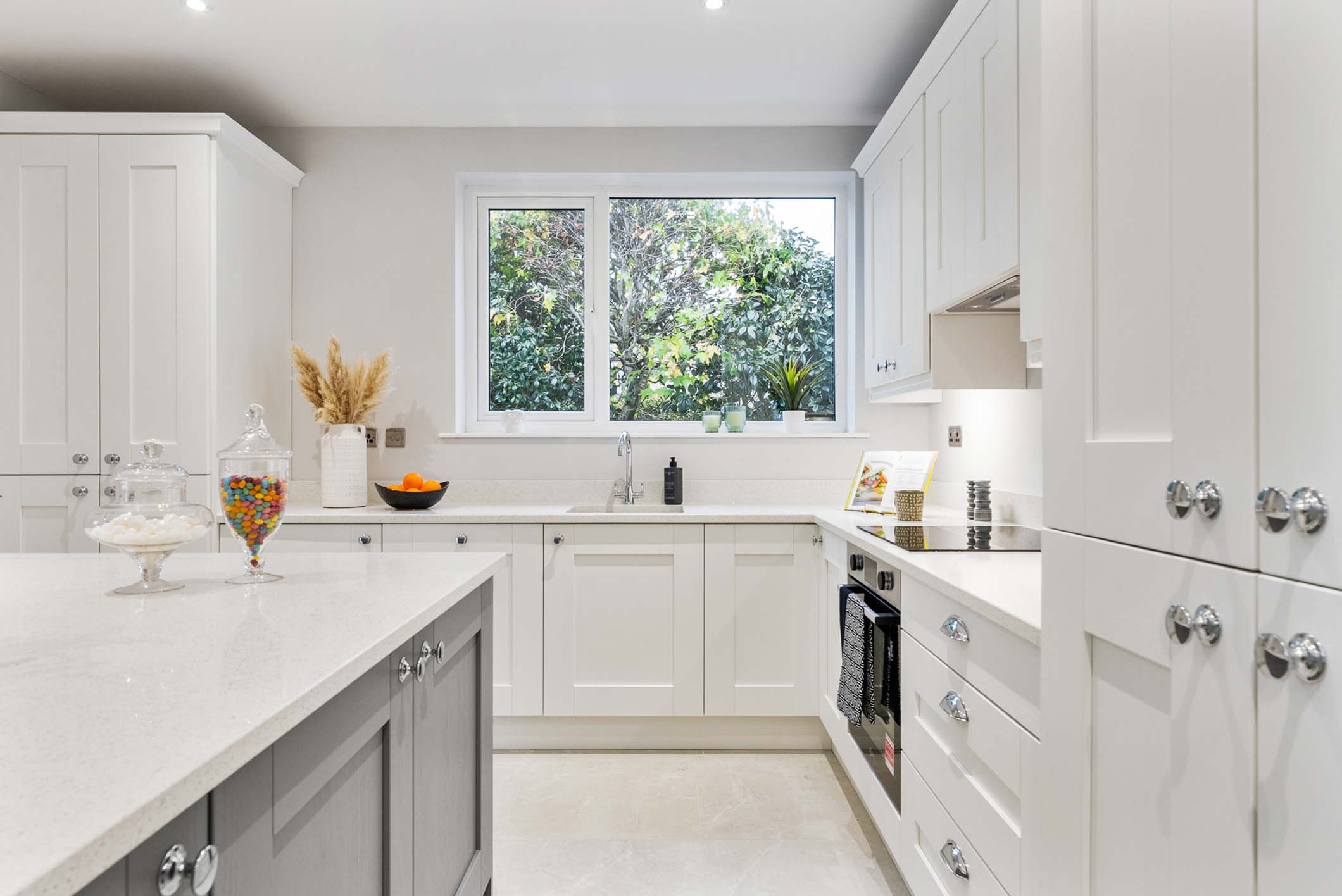 epic property staging white and navy kitchen